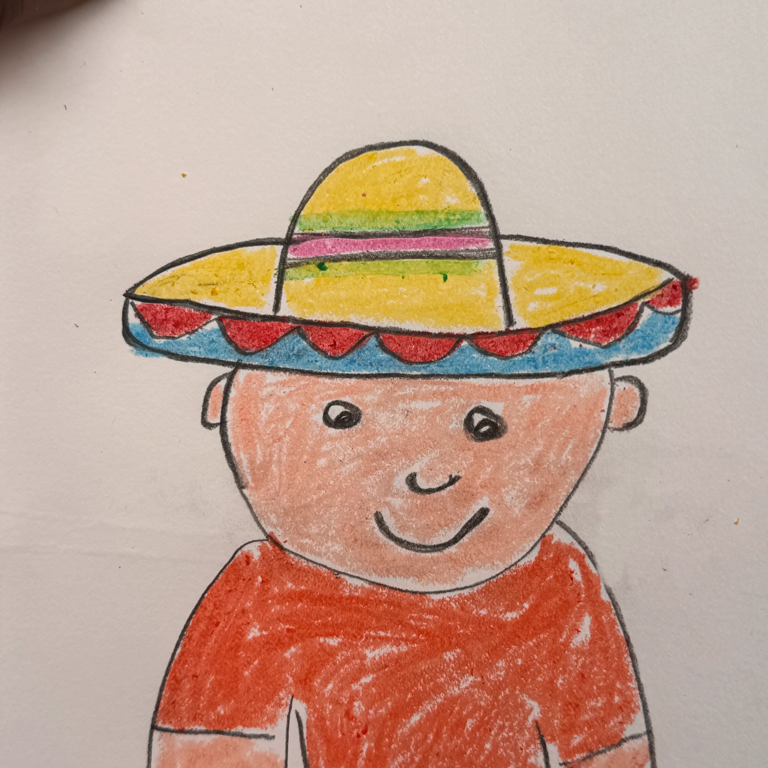 A drawing of a little boy wearing a sombrero