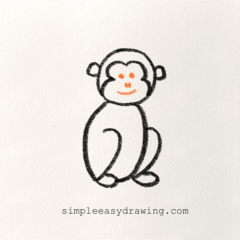 Step six of the drawing shows the Monkey’s eyes, nose, and smiling mouth drawn on the face.