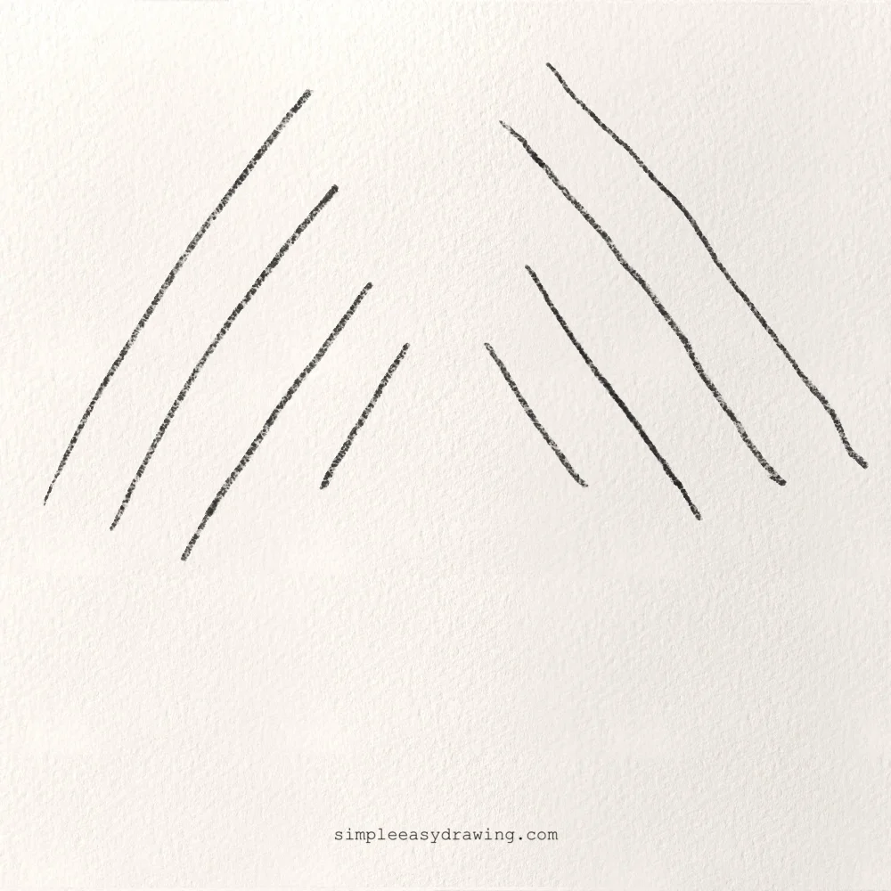 Drawing diagonal lines in opposite directions as part of drawing practice for beginners to improve balance