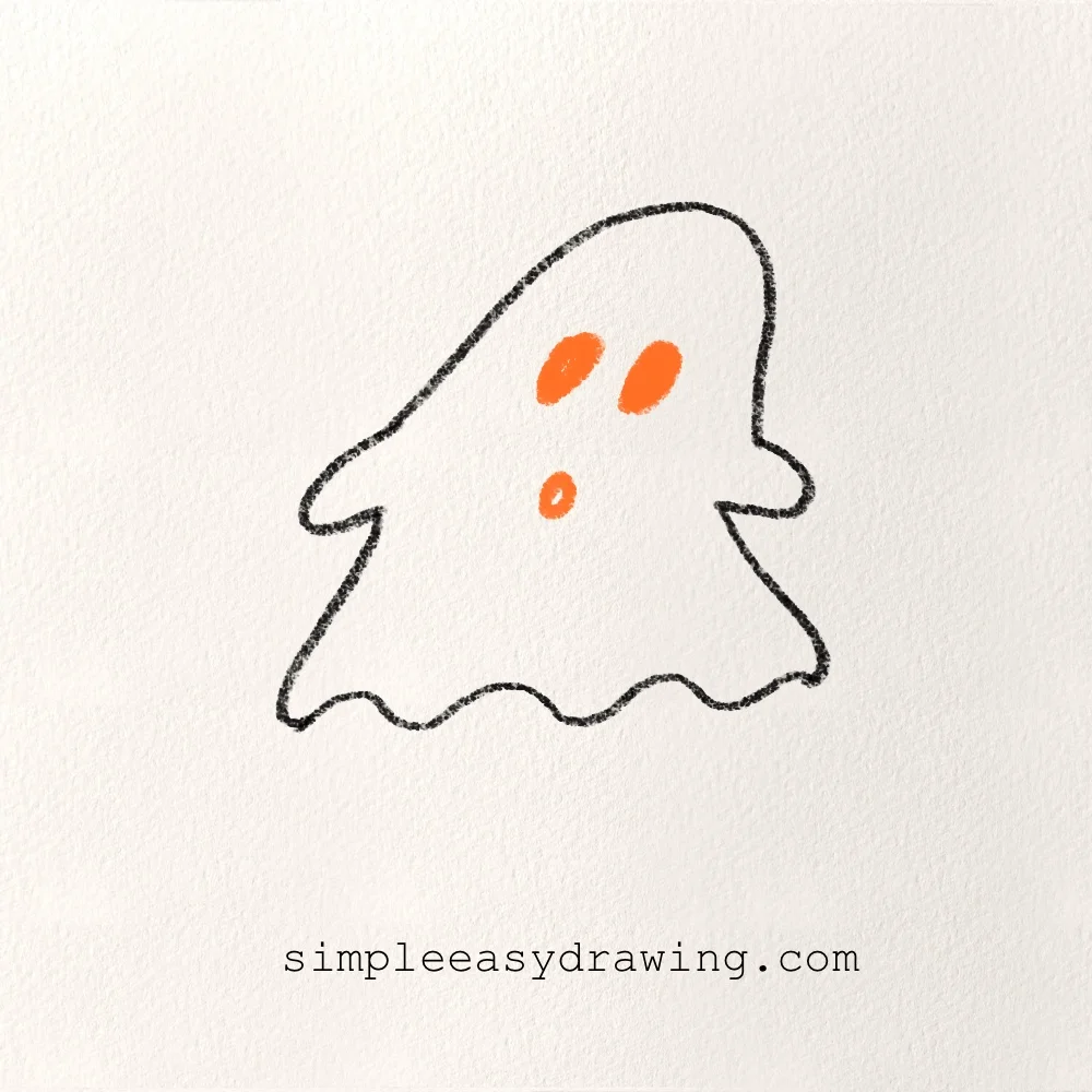 Adding two oval eyes and a small round mouth to the ghost.