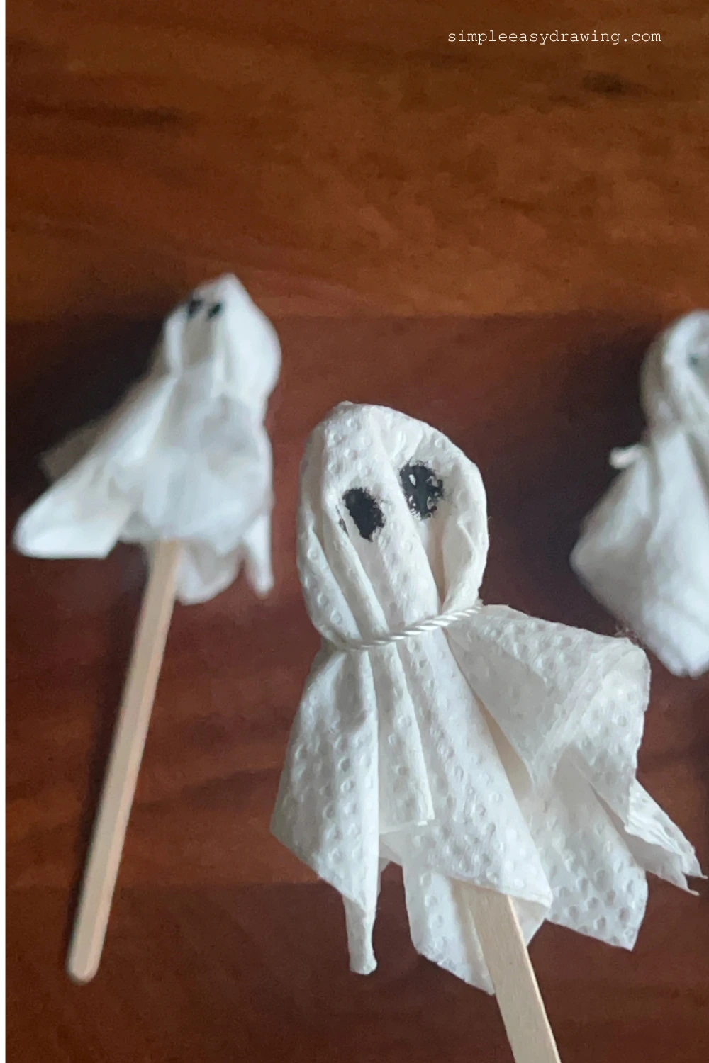 A set of DIY halloween ghost craft displayed